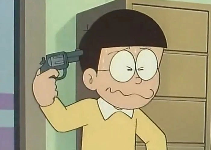 Nobita cầm súng chĩa vào đầu mình